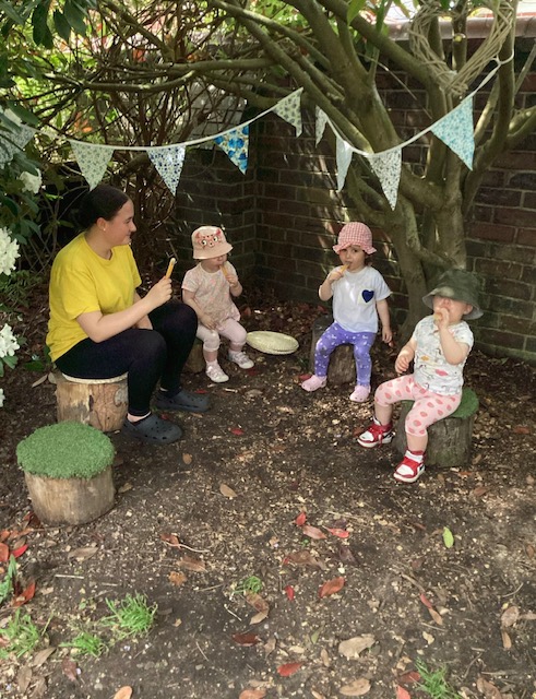 children play outside bolton nursery